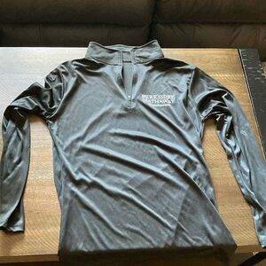 Black quarter zip long sleeve top. Berkshire Hathaway HomeServices logo